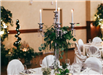 Elaborate Centerpiece Involving a Candelabra and Greenery